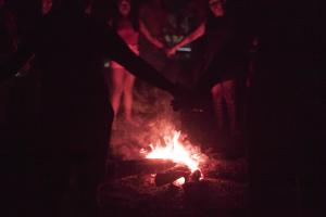 Ka'apor playing at the bonfire in the Brazilian Amazon (Photo: WRM)